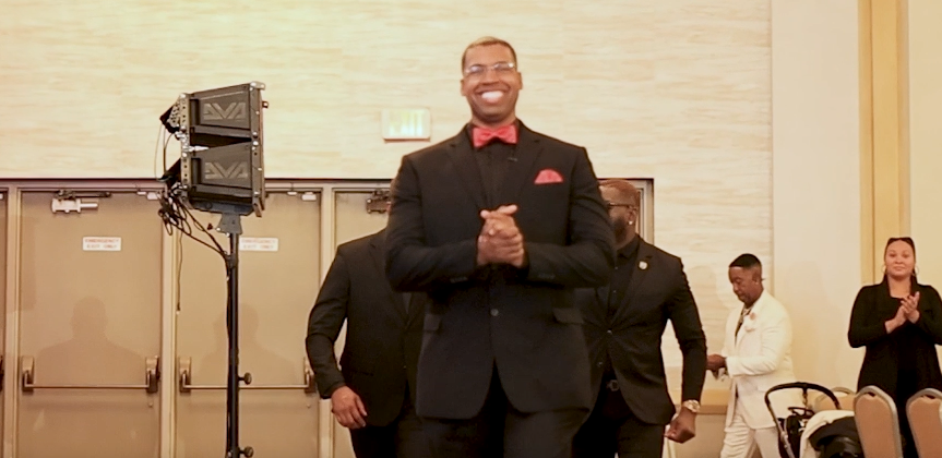 Attendee making a grand entrance to applause