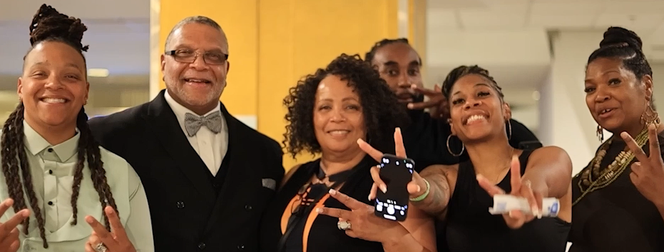 Group of attendees smiling together at the convention